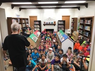 Students listen to Library Director-.jpg